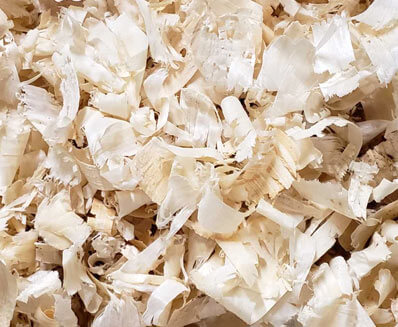 Close up of the wood shavings produced by Mala Mills, LLC for premium animal bedding